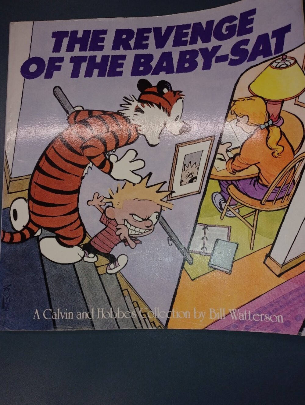 Calvin and Hobbes 'The Revenge of the Baby-Sat' Book - Orange & Black Cover